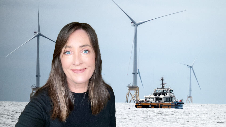 Melanie with an offshore wind field in background