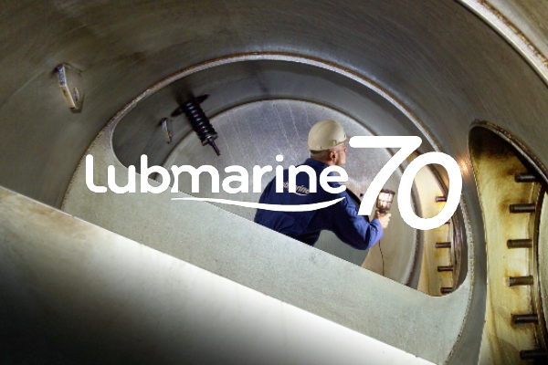 Marine lubricant Engineer inspecting a cylinder with Lubmarine 70th anniversary logo