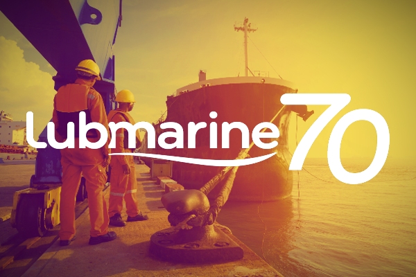Lubmarine 70th anniversary logo with a cargo vessel at berth behind 