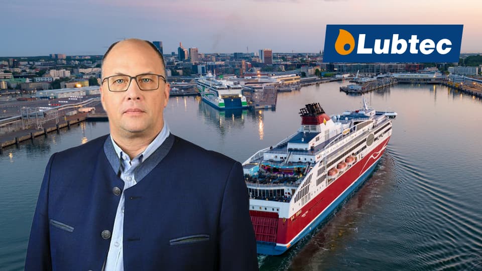 Jaanus Lember the CEO and founder of Lubtec with logo and harbor in background