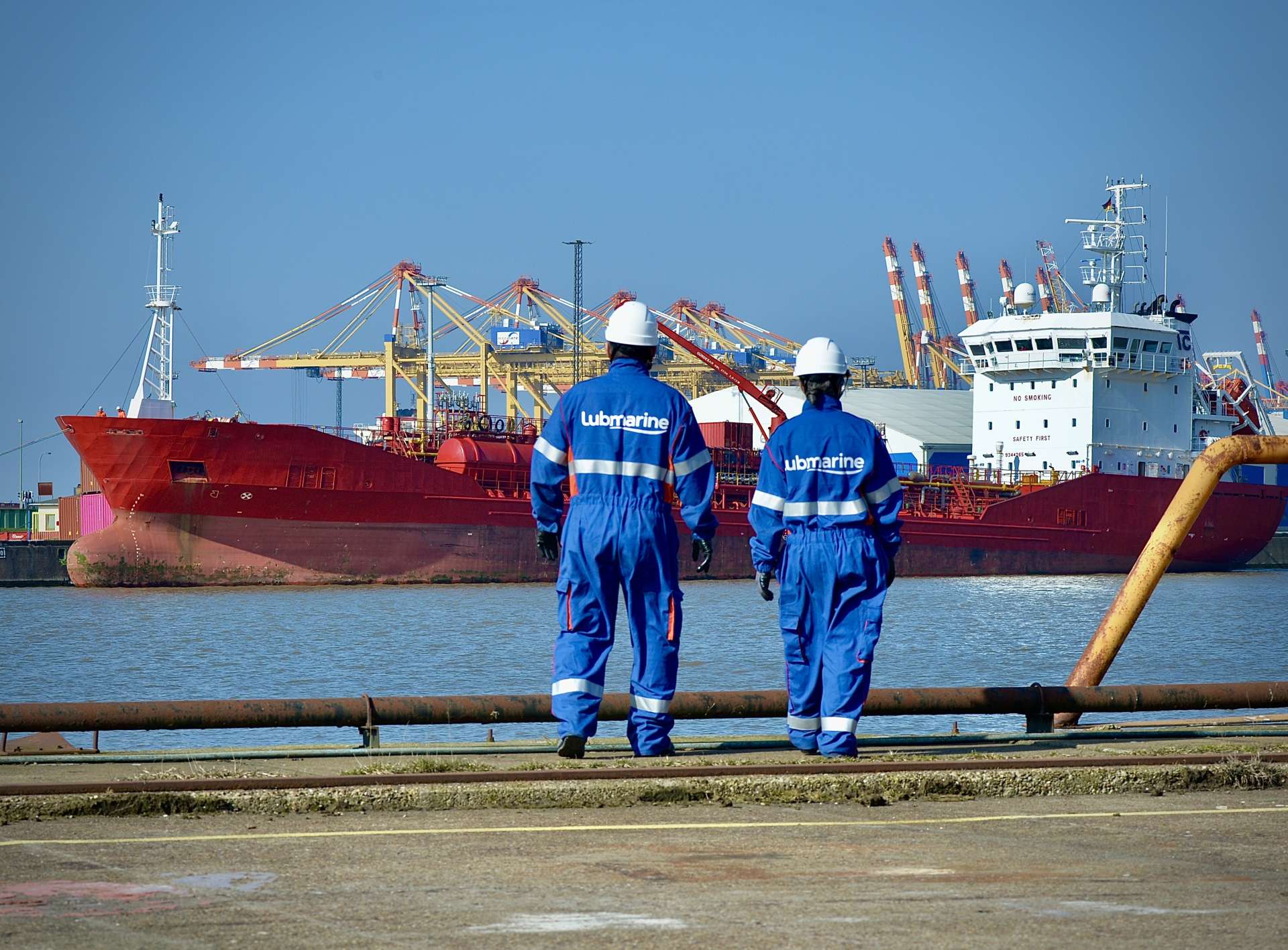 Lubmarine technical Engineers at port looking at a vessel at berth
