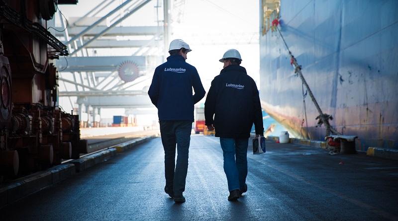 Two workers walking on a dock