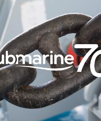 ©TotalEnergies Lubmarine 70th anniversary logo with a mooring chain in background