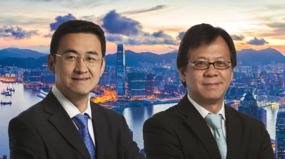 Chris Ho and Mike Wong with Hong Kong in background