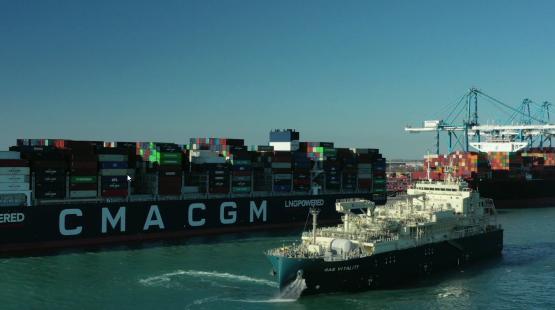 Gas Vitality Bunkering Barge in the Port of Marseille Fos next to a CMA CGM ship
