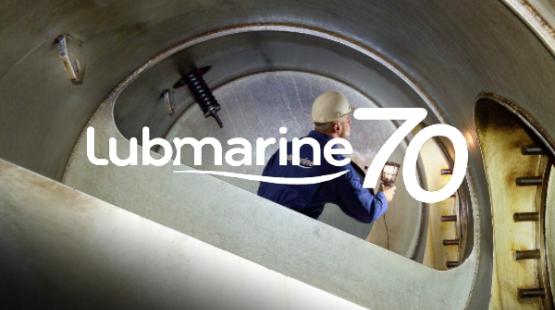 Marine lubricant Engineer inspecting a cylinder with Lubmarine 70th anniversary logo