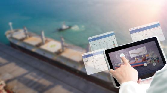 Shipping operator consulting a dashboard on an Ipad - bulk vessel in background