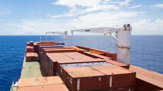 ©TotalEnergies, Adobestock 2024 Container vessel heading to horizon