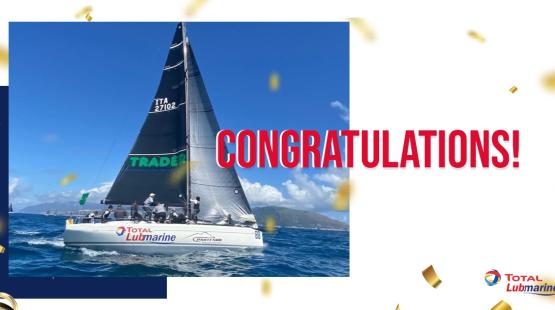 Picture of the Scugnizza yacht with the word "congratulations" written in red next to it.